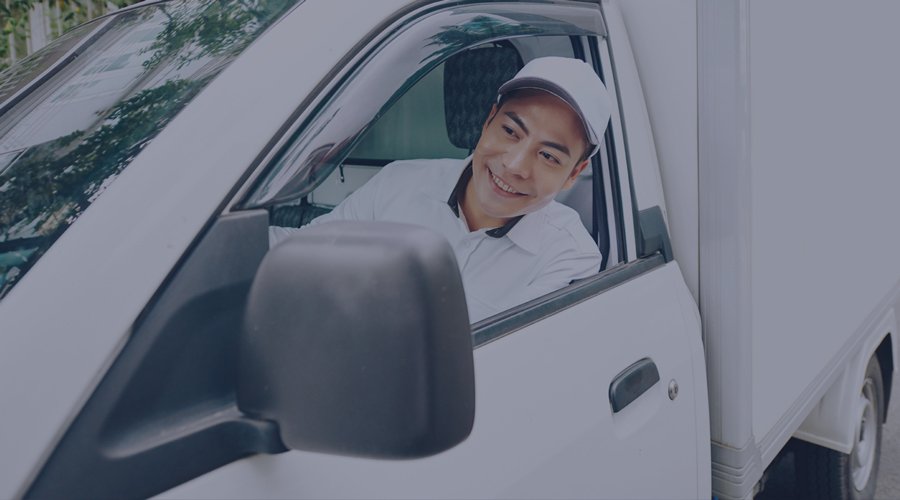 Driver leaning outside truck window