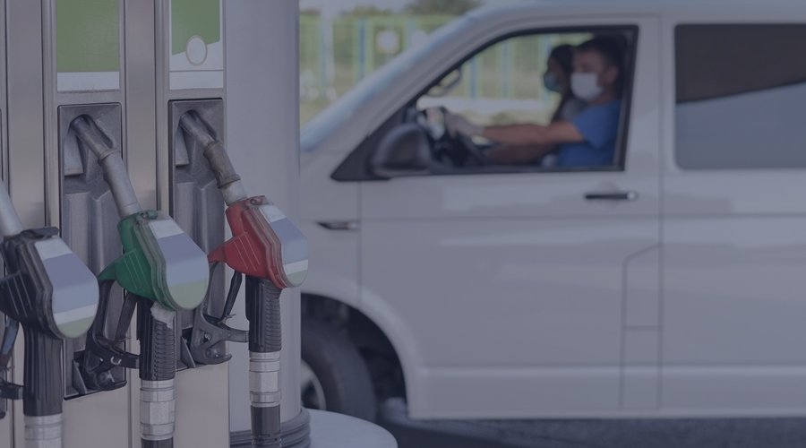 Gas pump with three nozzles in the foreground