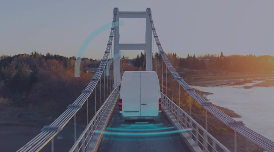 Delivery truck crossing a bridge