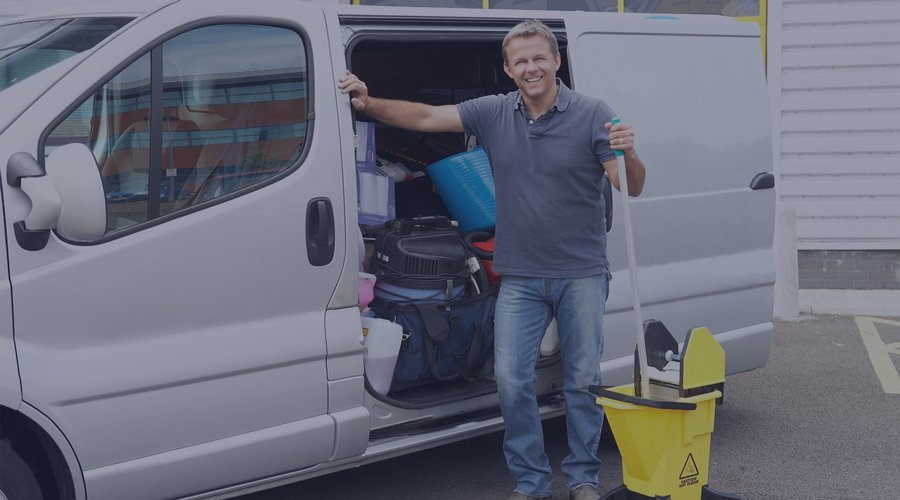 Cleaning service employee holding a mop and bucket