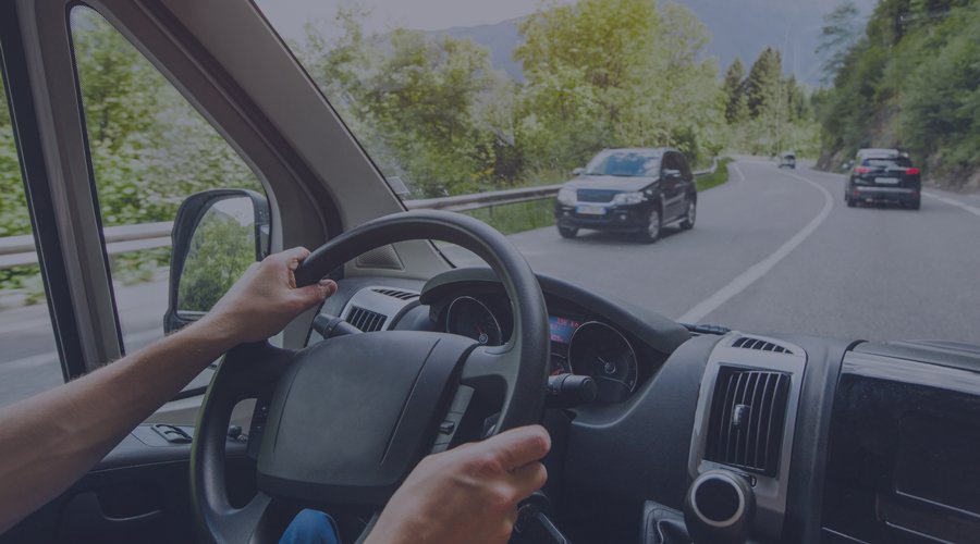 Driver travelling along a winding road.