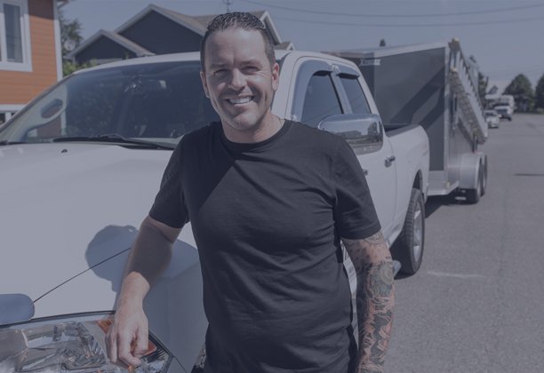 Man standing beside truck