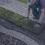 landscaper laying sod