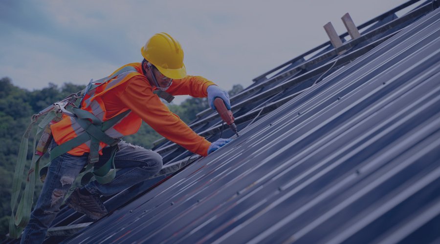 Man working on top of roof