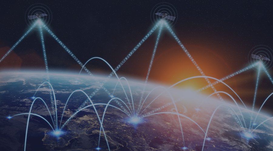 Three satelites in space above Earth sending signals.